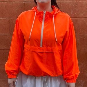 Bright neon orange windbreaker
